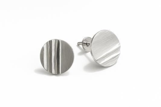 Pair of silver earrings on a white background